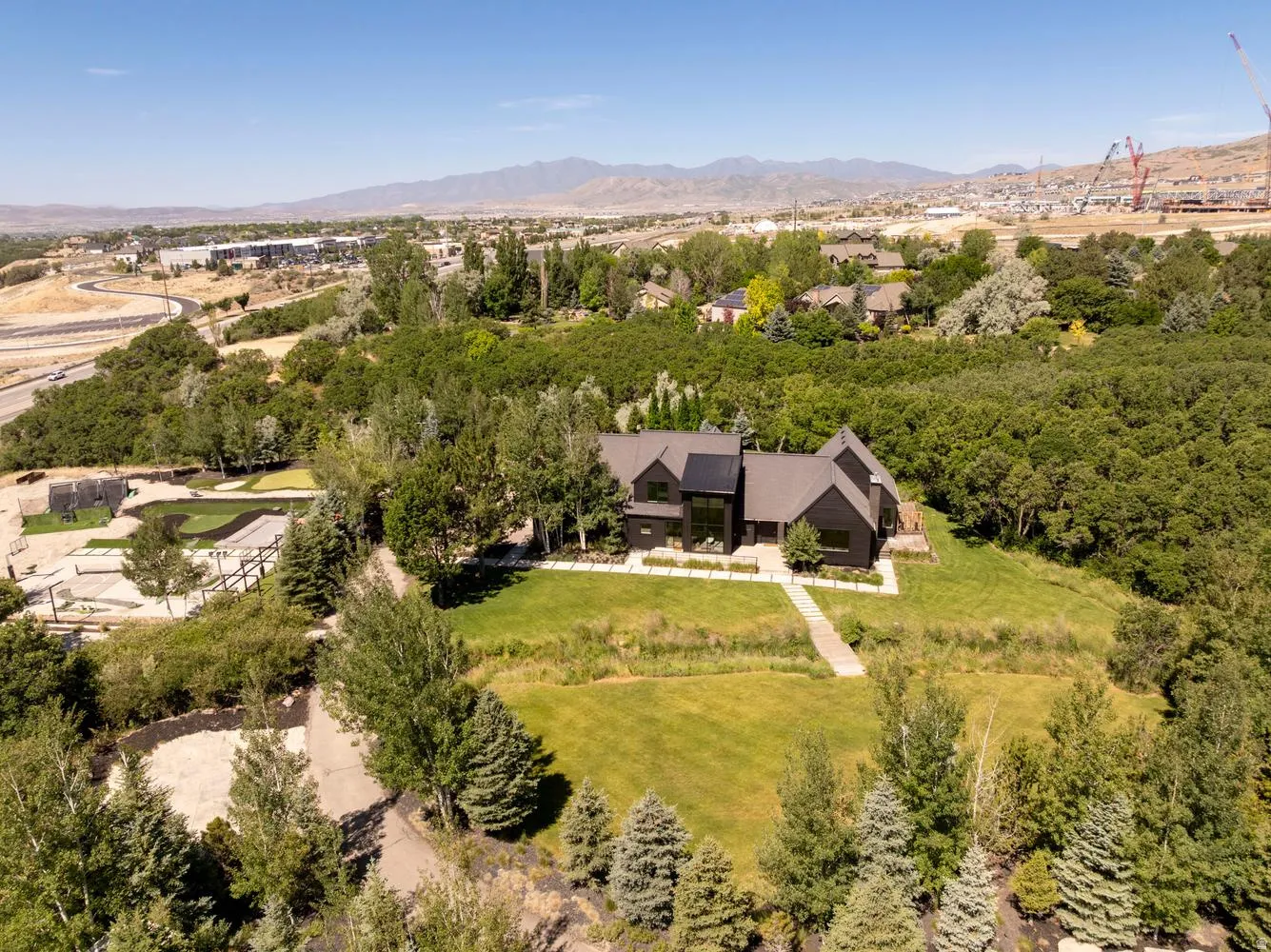 Architecturally beautiful home surrounded by mature trees, natural and professional landscaping, and plenty of amenities