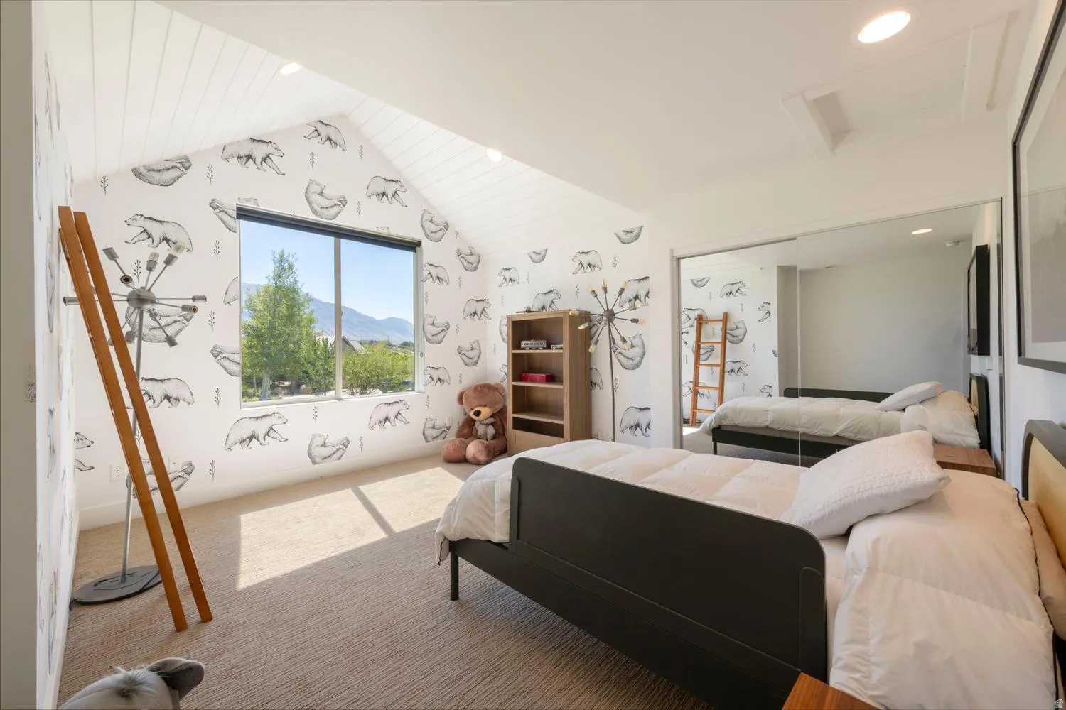 Vaulted ceiling room featuring a large window, recessed lighting, wall-to-wall carpeting, and mirror