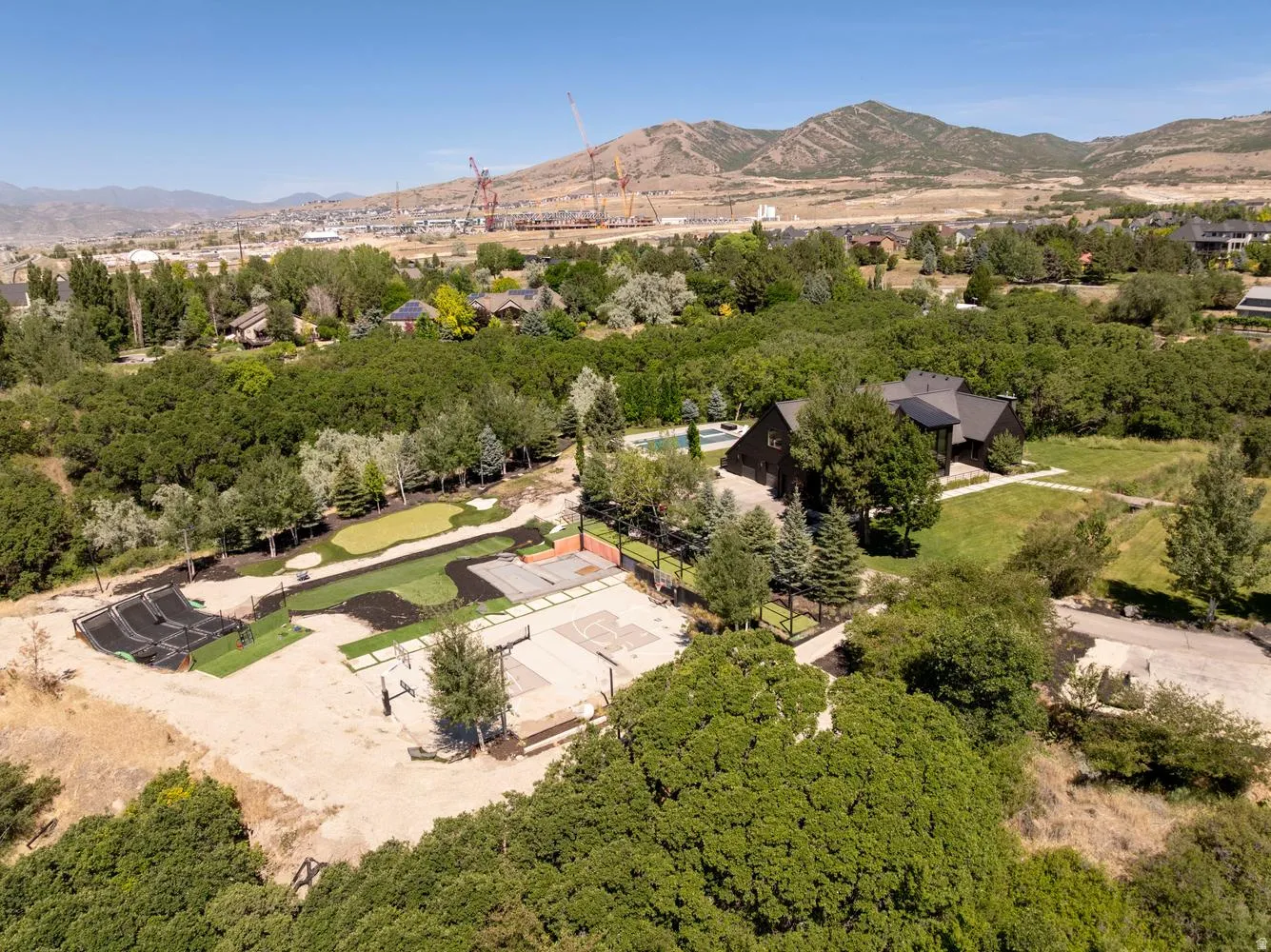 In addition to the pool, hot tub, basektball/pickleball court, putting green, and trampoline grid, this property can have horses!!