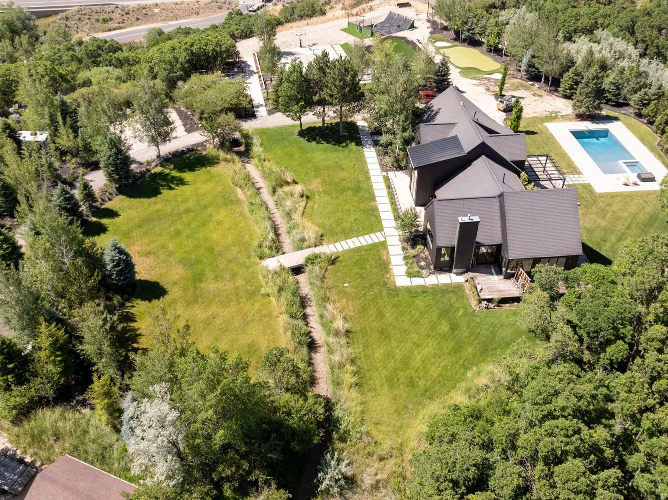 Aerial look at 2.29 acre property with swimming pool and other amenities