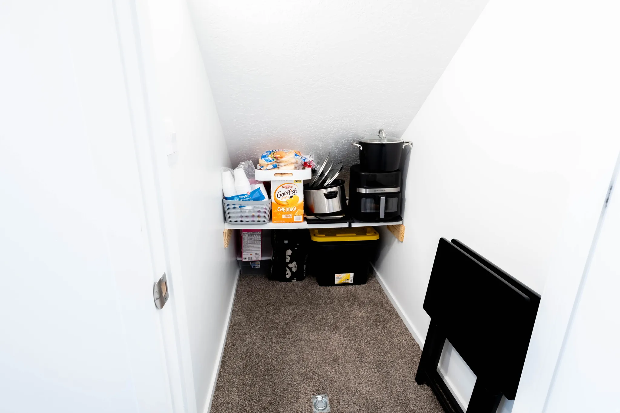 Storage under the stairs.