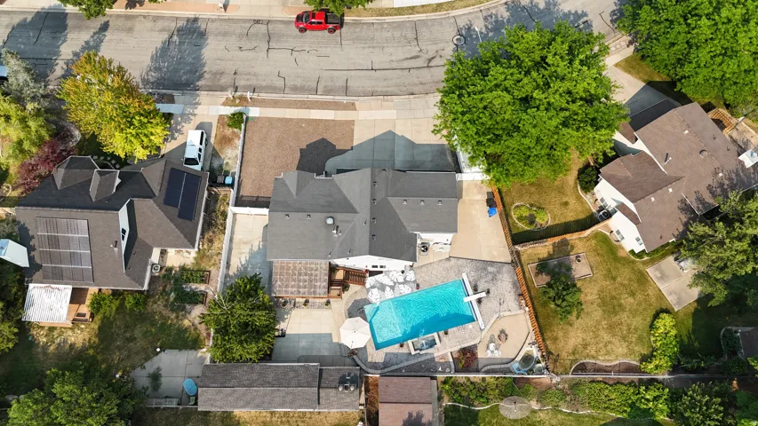 Outdoor living space featuring a rectangular swimming pool, integrated spa, and expansive paver patio