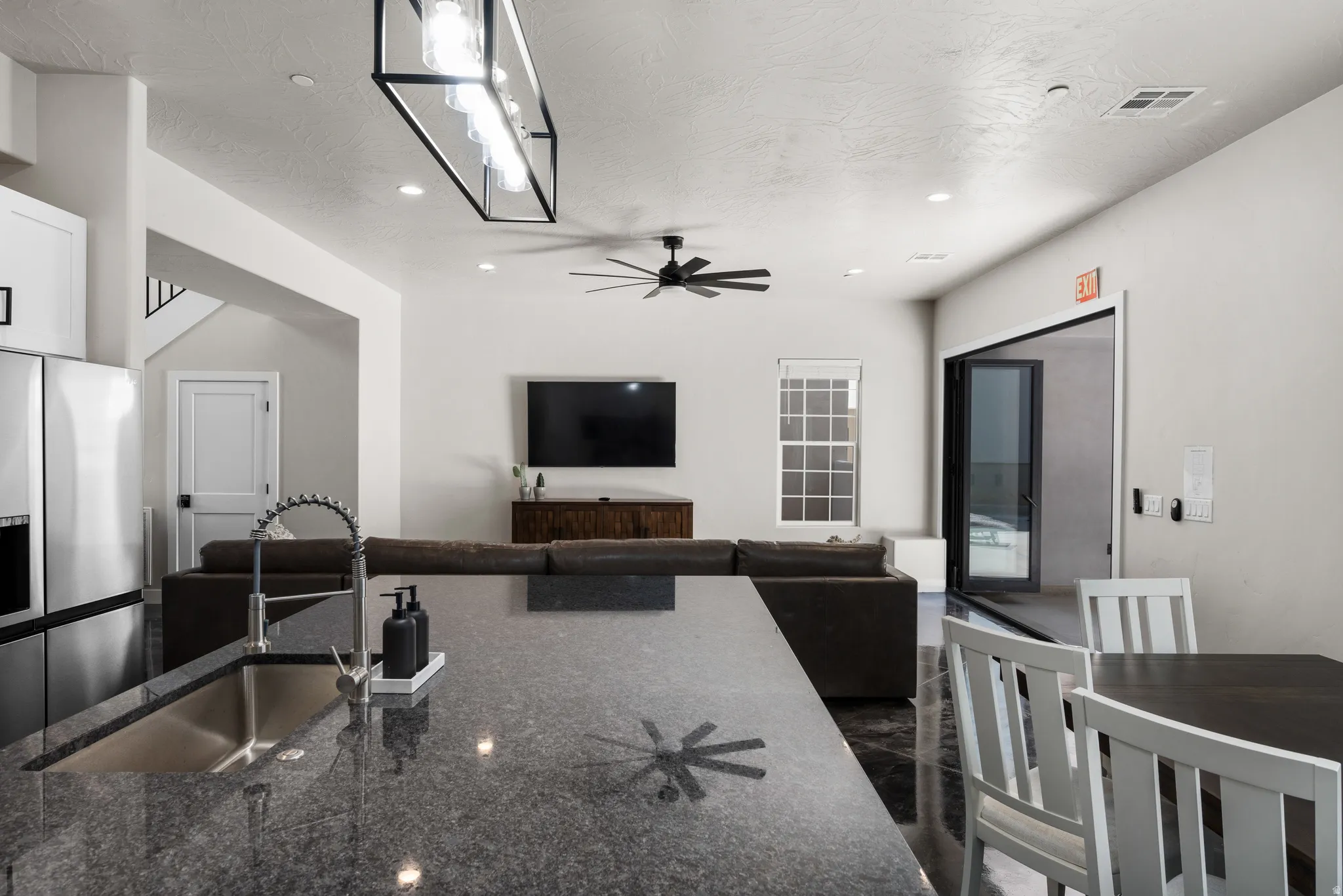 Kitchen island with an undermount sink and a high-arc faucet