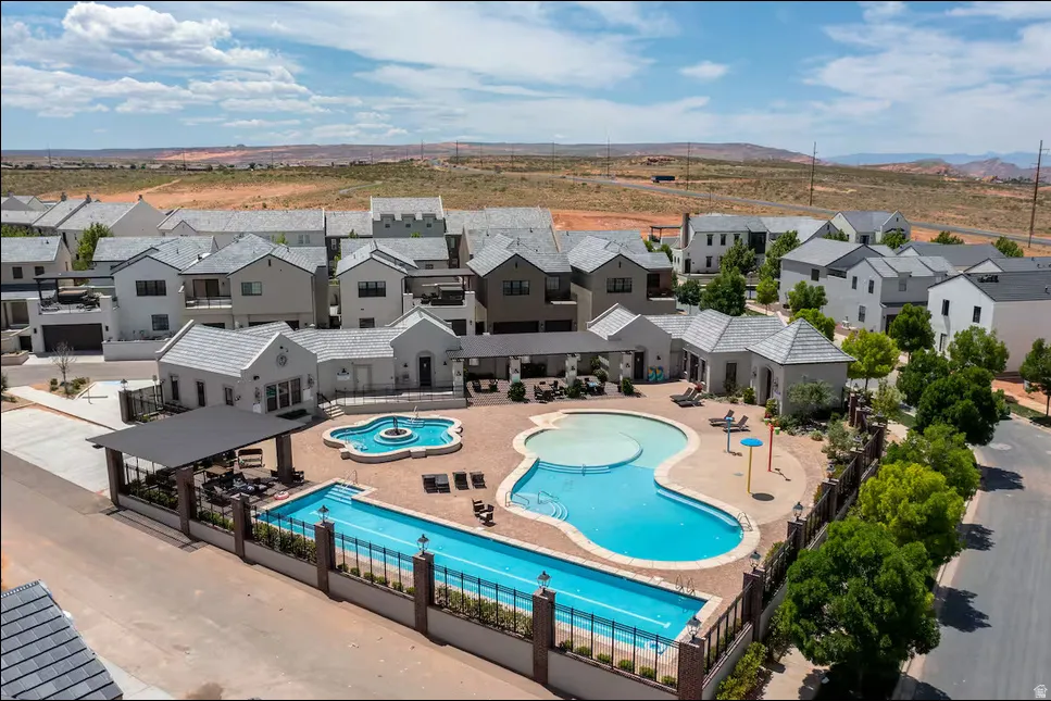 Community amenities featuring multiple swimming pools, a separate fountain pool, and covered outdoor seating areas