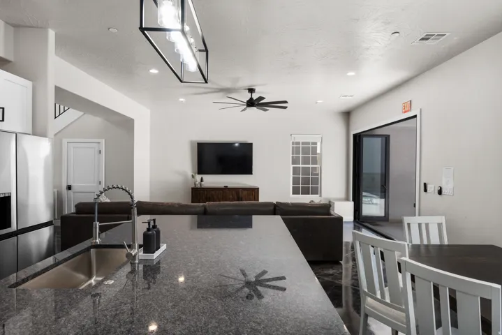 Kitchen island with an undermount sink and a high-arc faucet