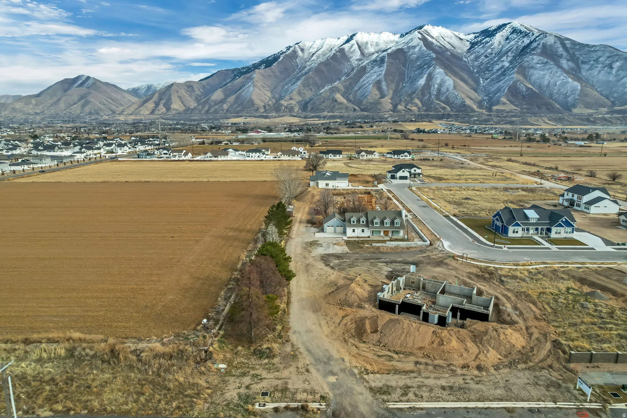 Expansive mountain range backdrop and surrounding undeveloped land