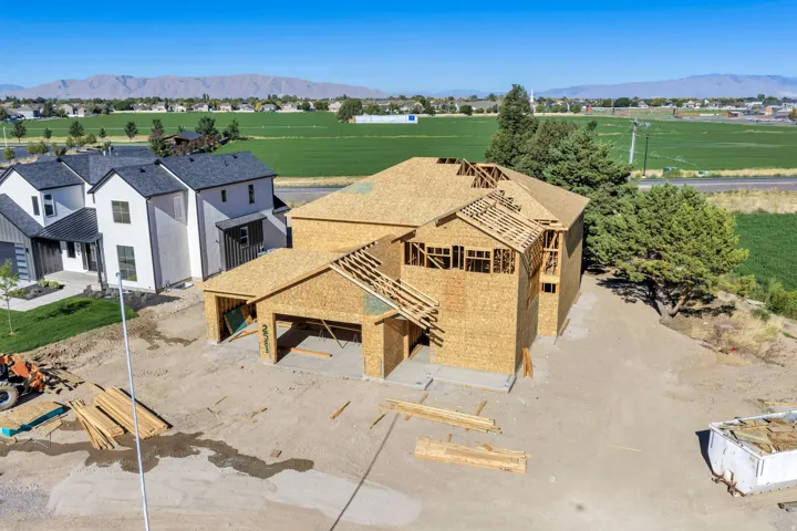 Wood-frame construction featuring a multi-level design and an attached garage
