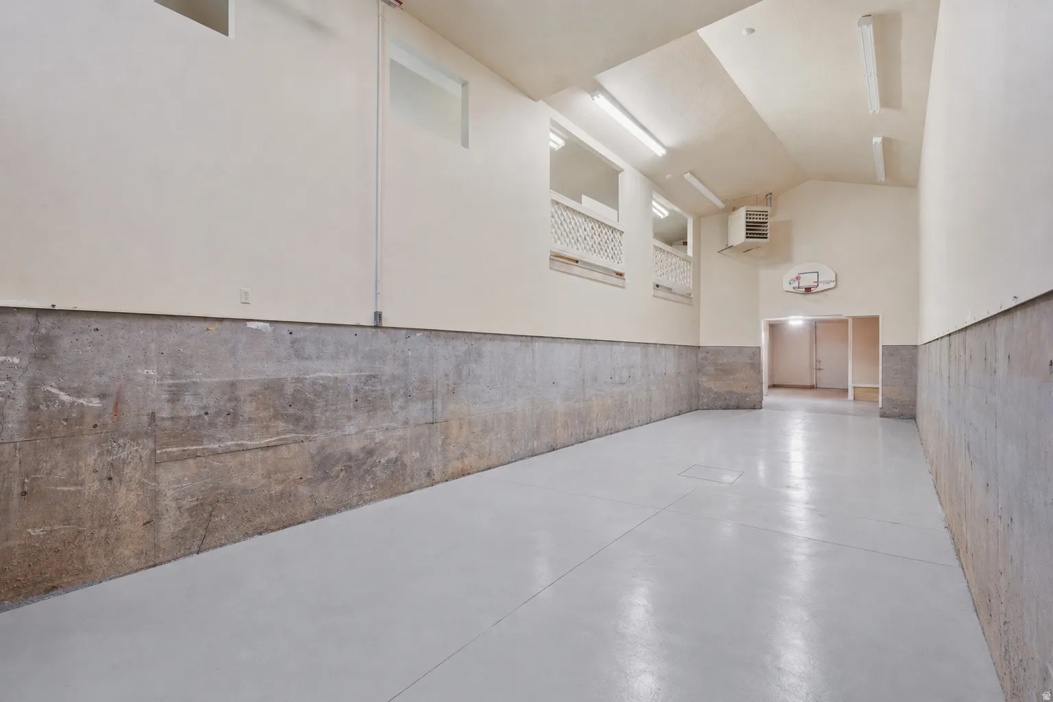 Spacious, heated multi-purpose RV garage featuring 2nd level storage, storage that runs adjacent, shop/storage space in the back