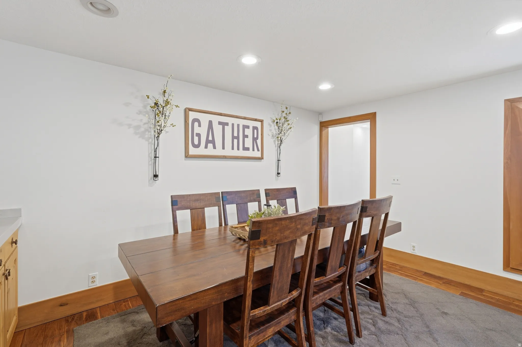 Dining area featuring recessed lighting and wood flooring