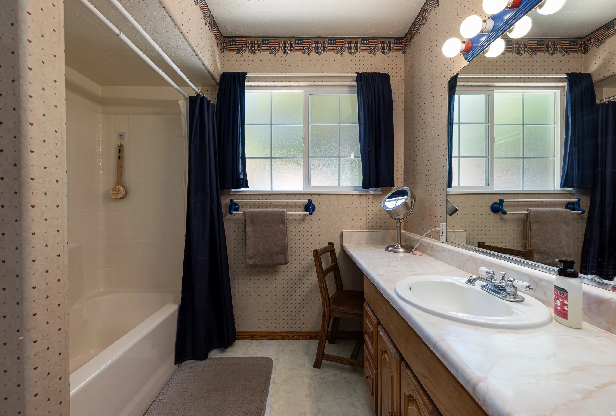 Spacious bathroom with tub and shower and extra long vanity sink