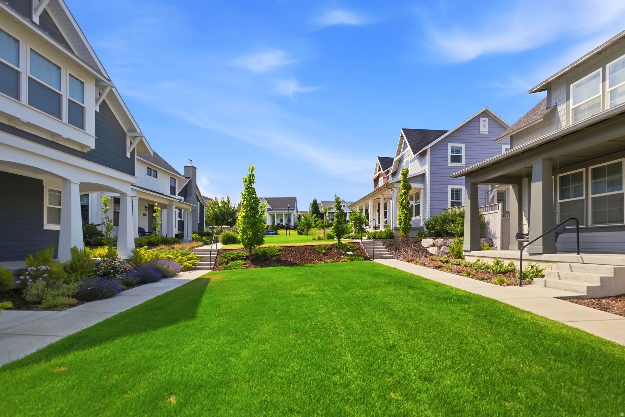 Expansive central green space featuring manicured lawn and mature landscaping