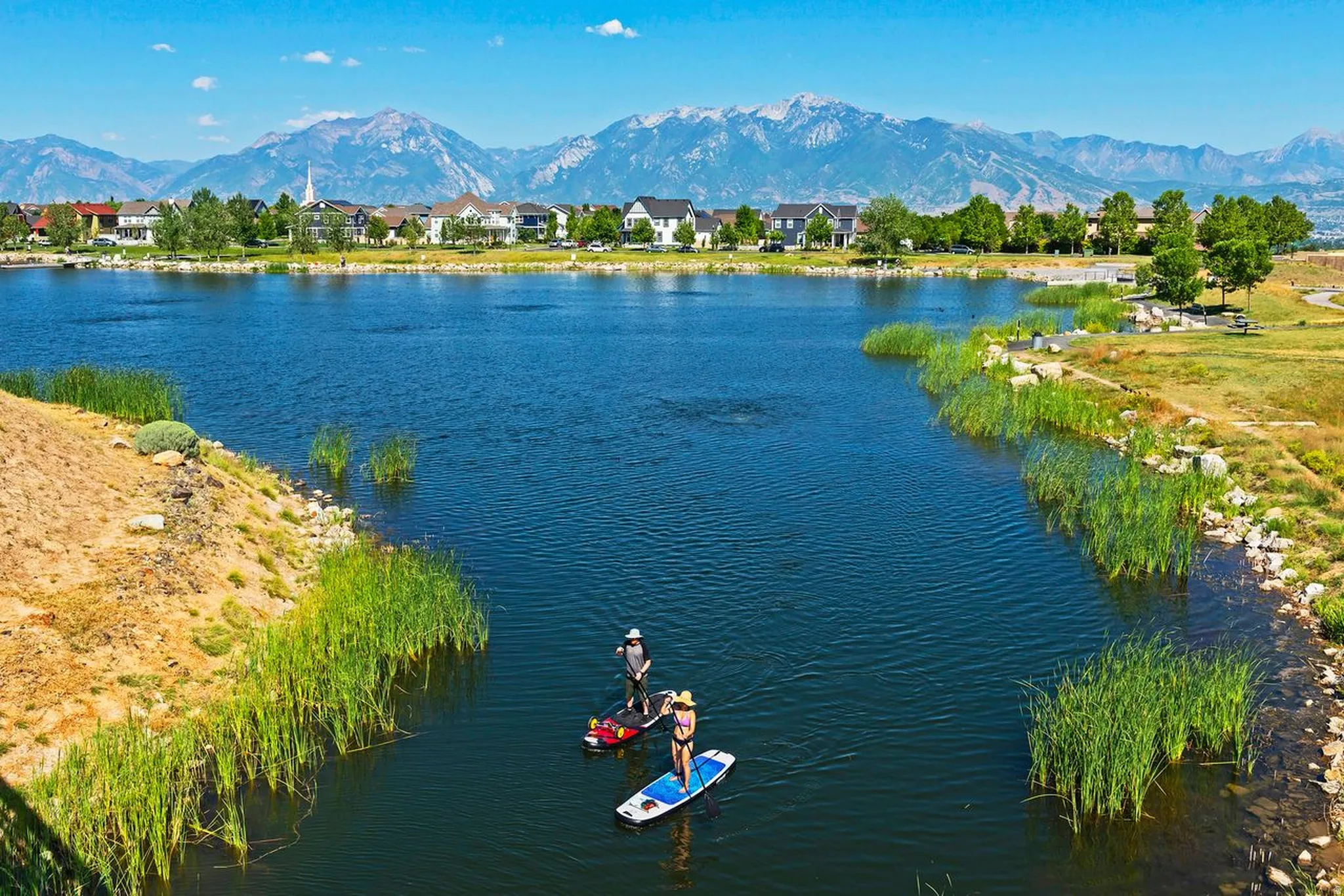 Expansive waterfront property featuring a large, natural-edged lake