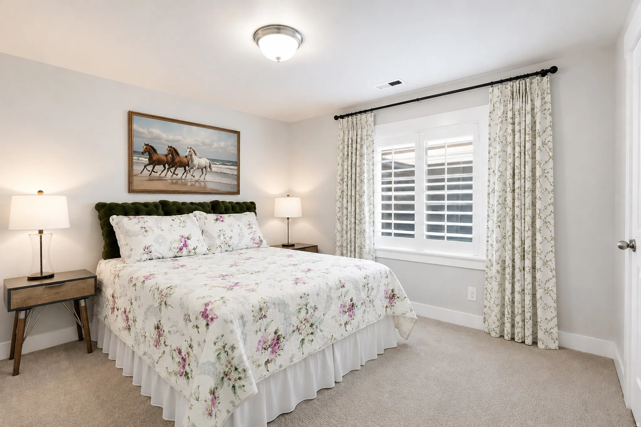 Bedroom featuring light gray wall paint and neutral carpet flooring