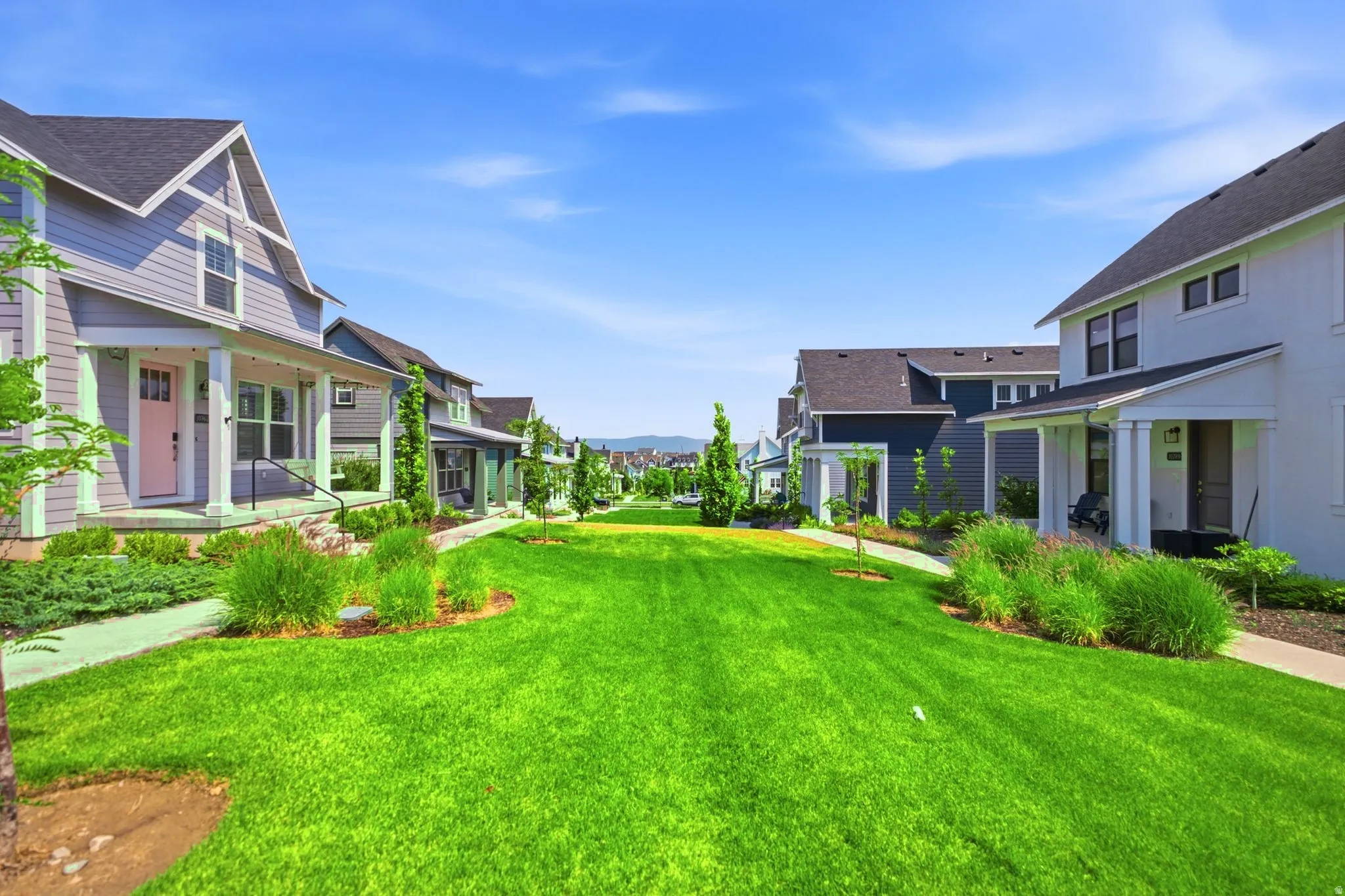 Expansive central green space featuring manicured lawn and mature landscaping