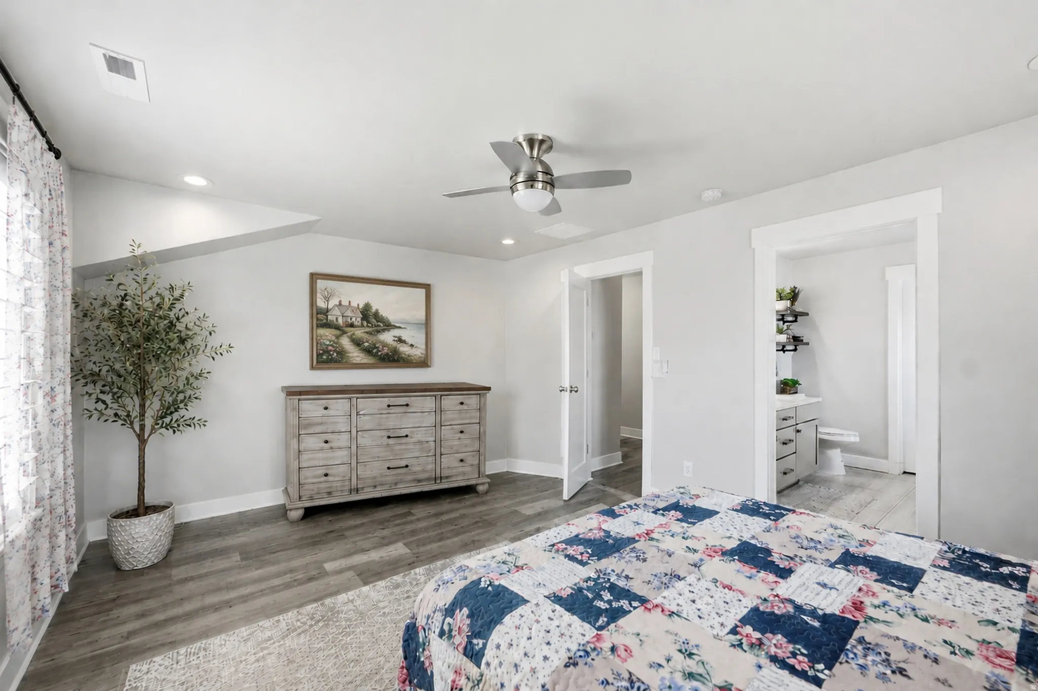 Neutral wall tones with wood-finish flooring
