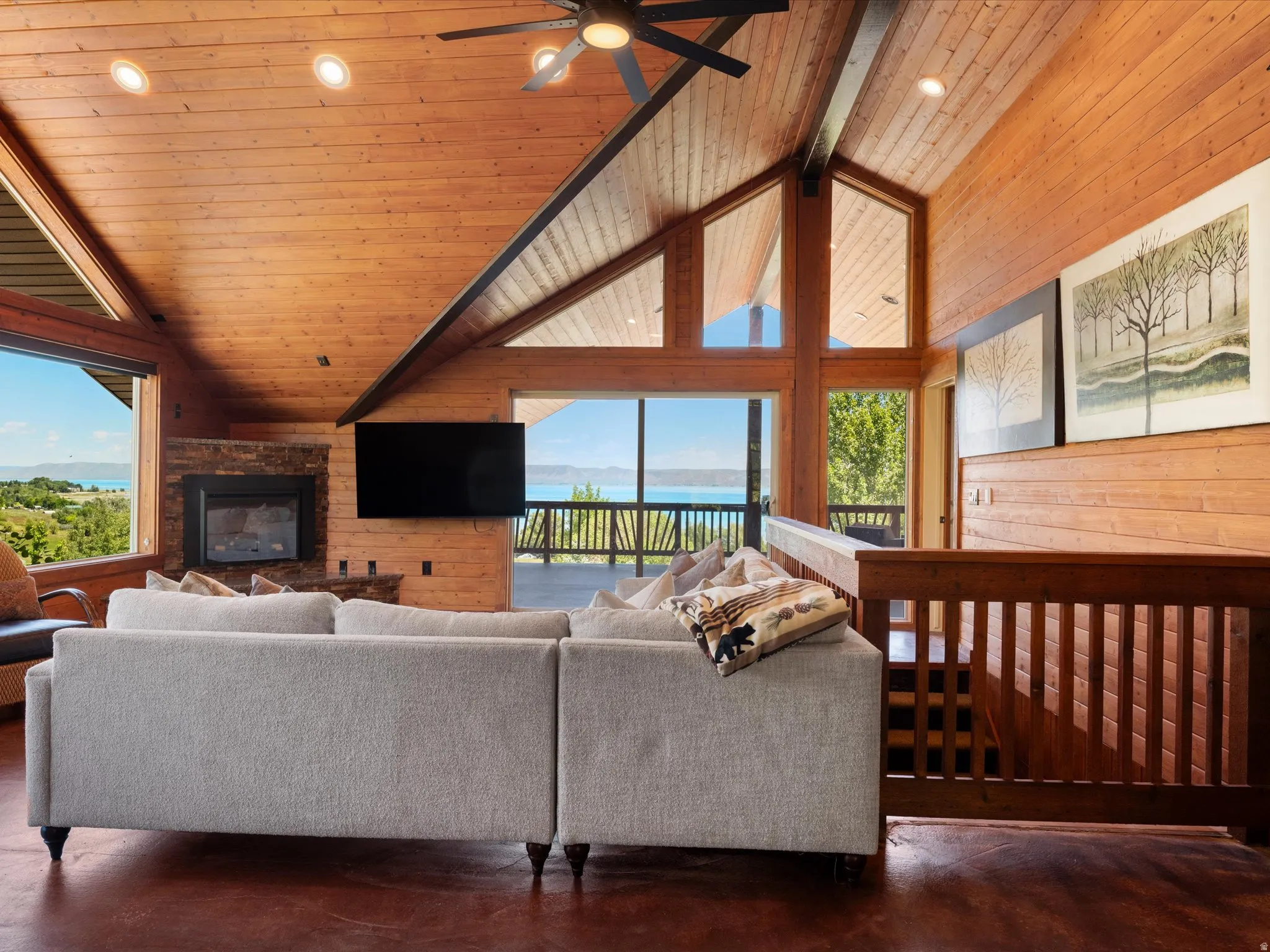 Vaulted wood-paneled ceilings with exposed beams and recessed lighting