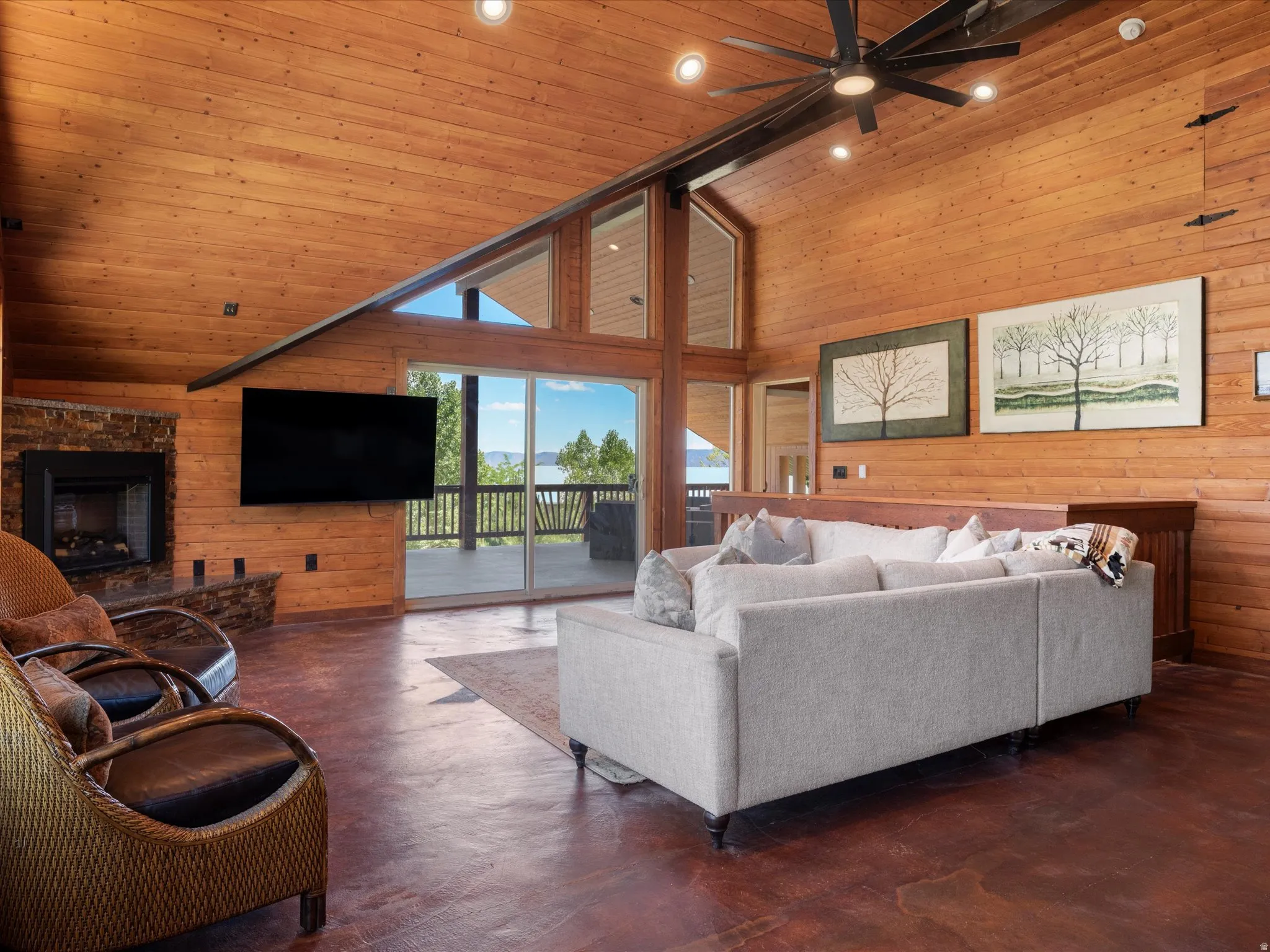 Vaulted wood-paneled ceilings with exposed beams and recessed lighting