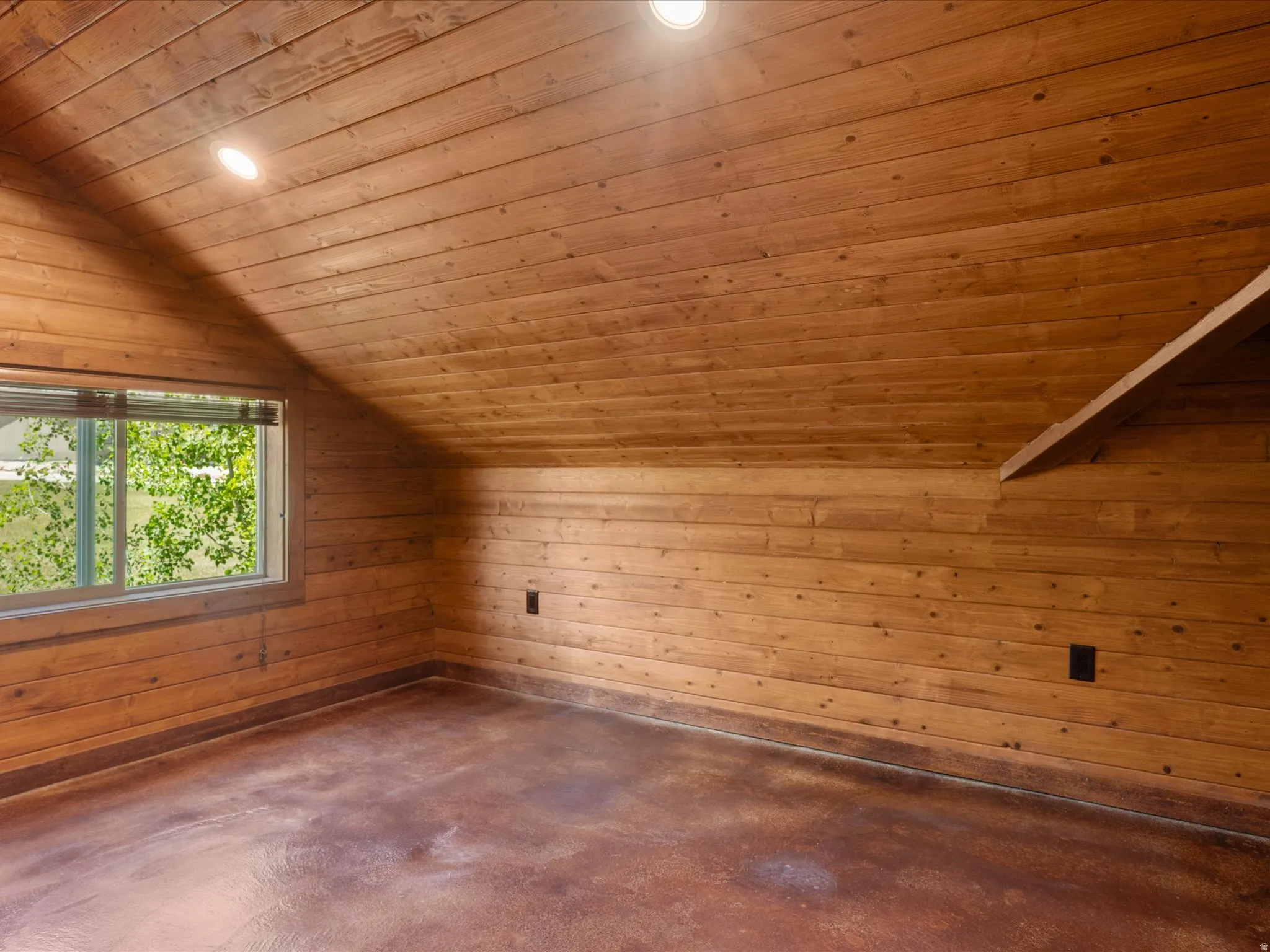 Room featuring wood-plank walls and ceiling, recessed lighting, and a horizontal window with blinds