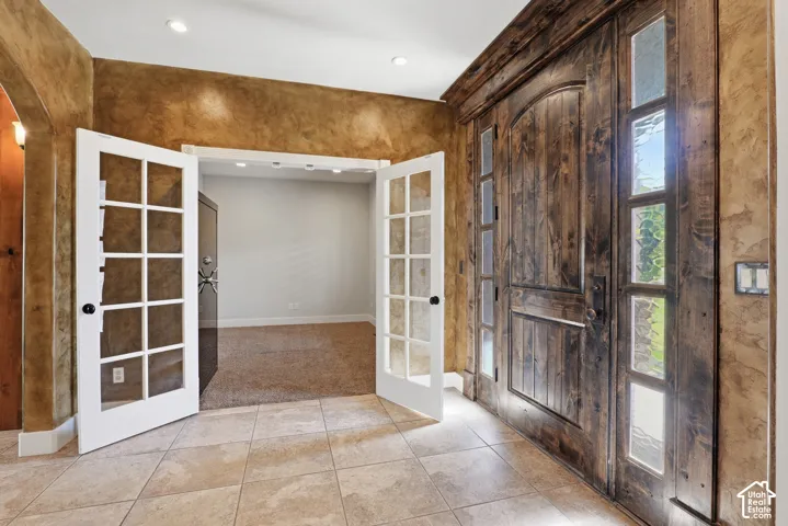 Rustic wood-finish double entry doors with sidelight windows