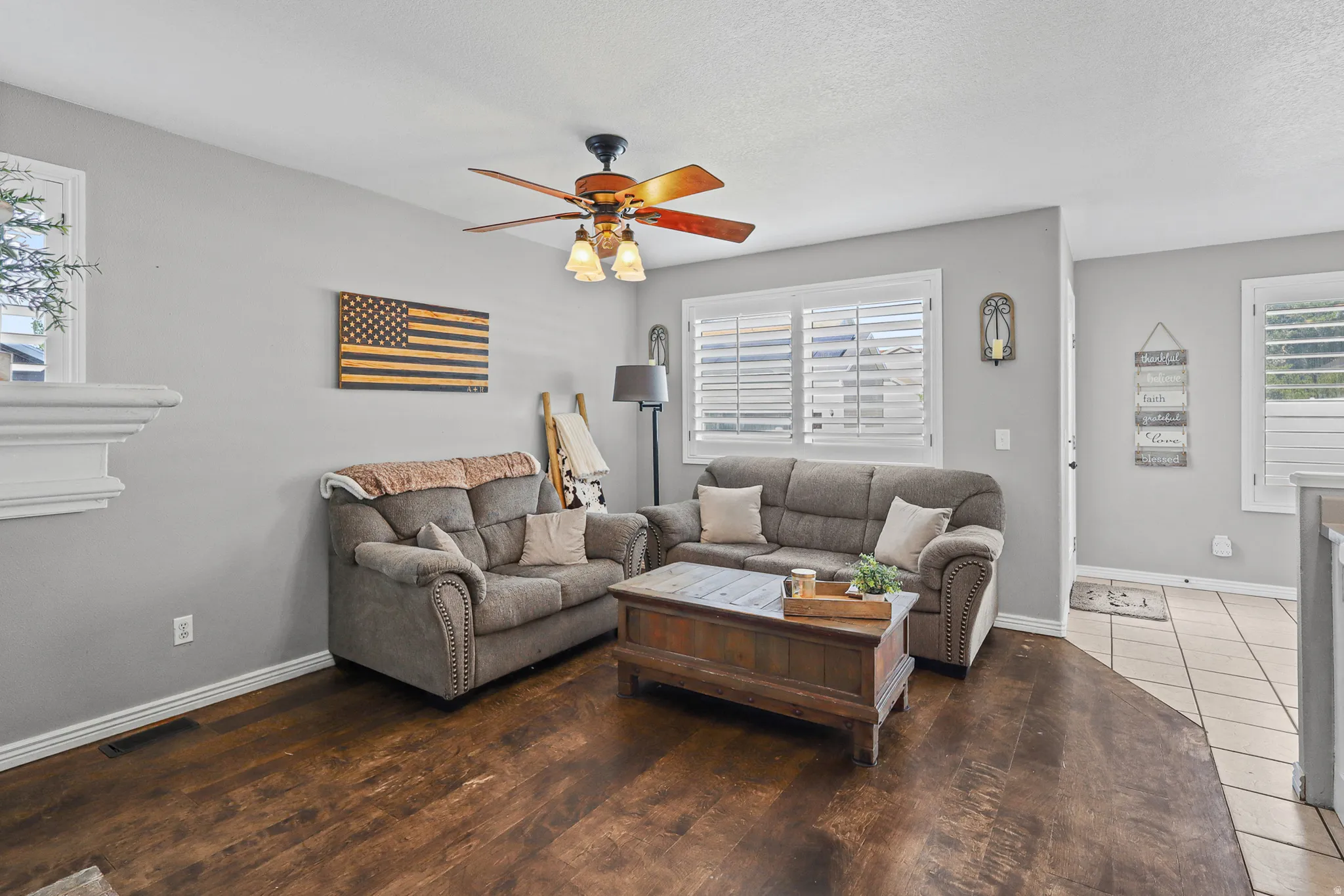 Living area featuring wood-finish flooring and light gray walls