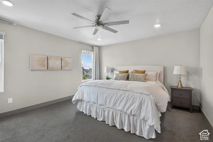 Spacious main bedroom featuring a private en suite bathroom