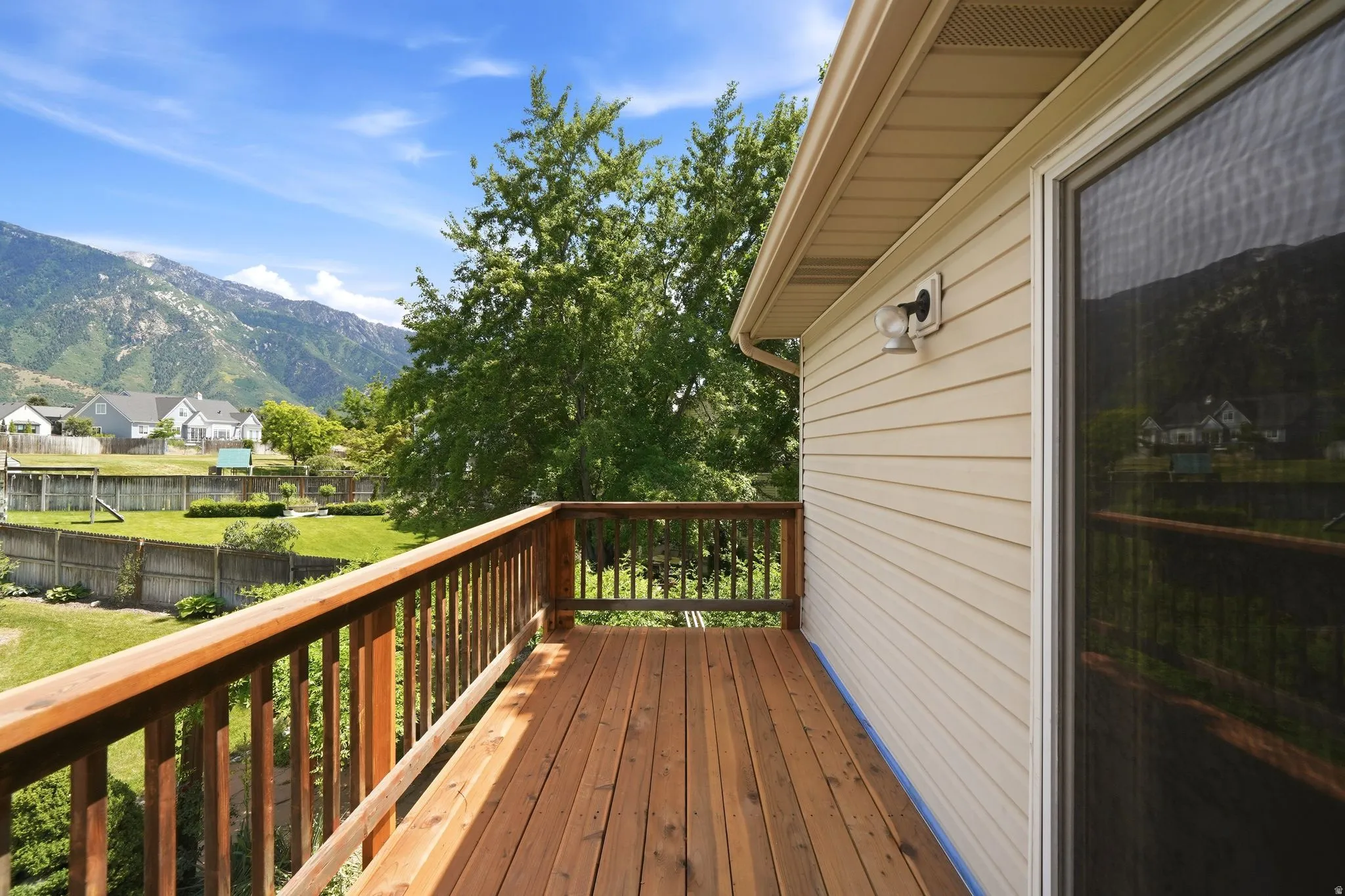 Wood-finish deck with a natural wood railing