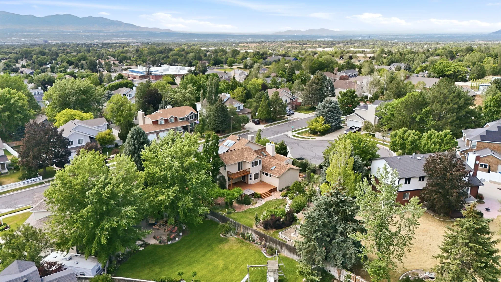 Expansive residential landscape featuring mature trees and established properties