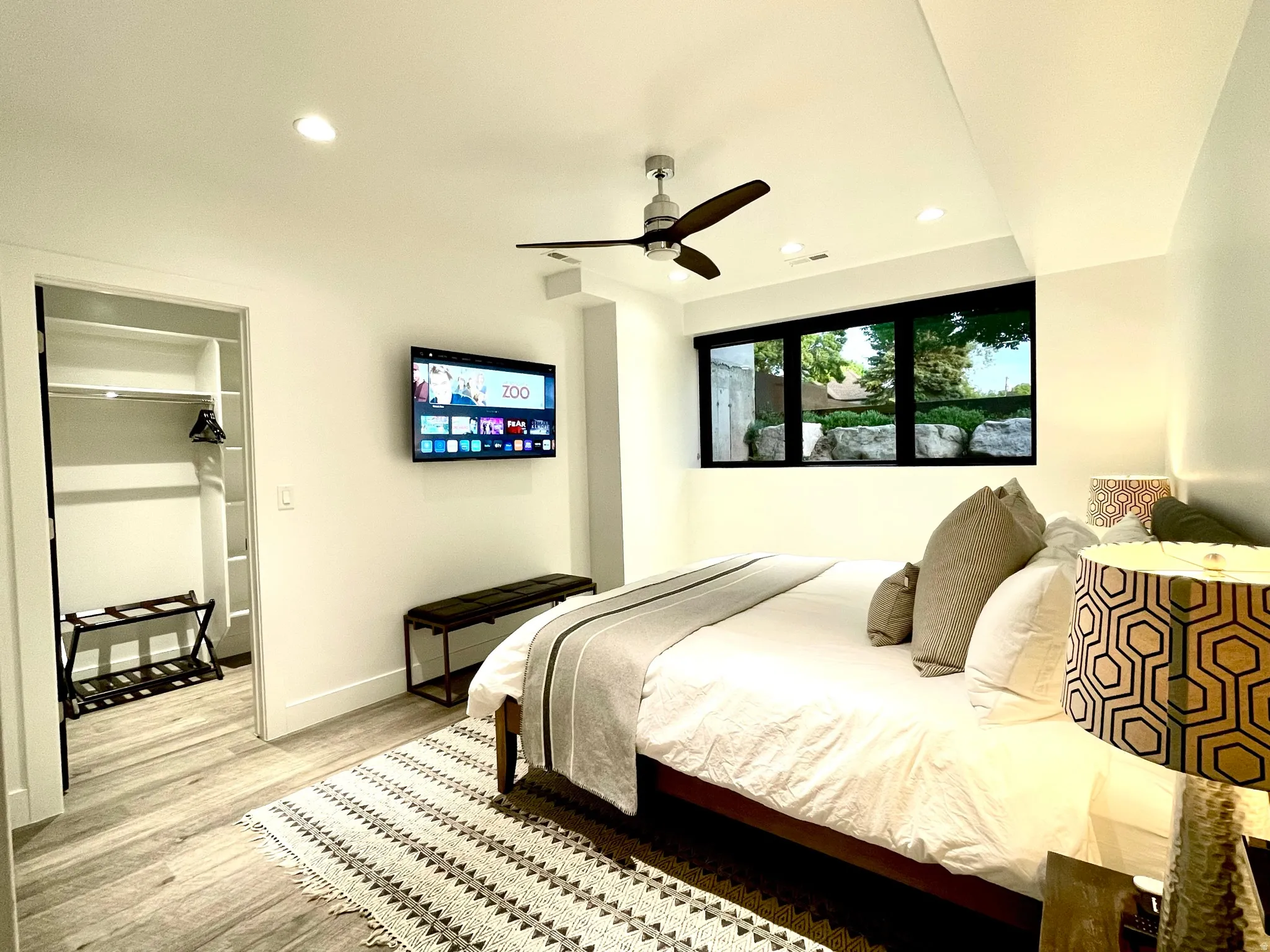 Bedroom featuring wood-finish flooring, recessed lighting, and a modern ceiling fan