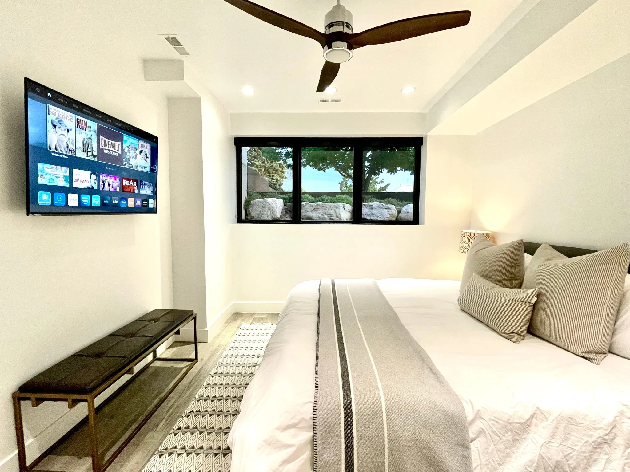 Bedroom featuring wood-finish flooring, recessed lighting, and a modern ceiling fan