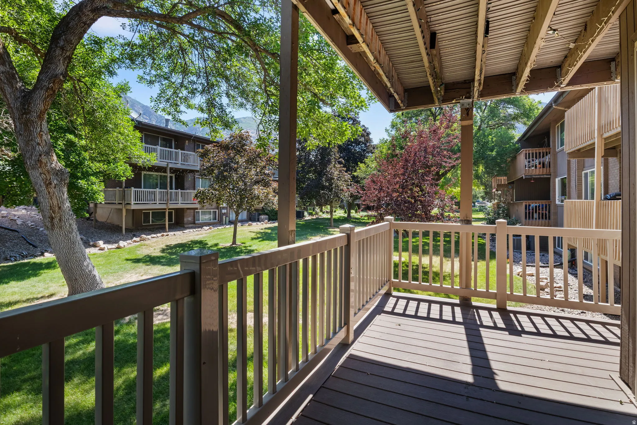 Private outdoor deck featuring composite decking and painted railings