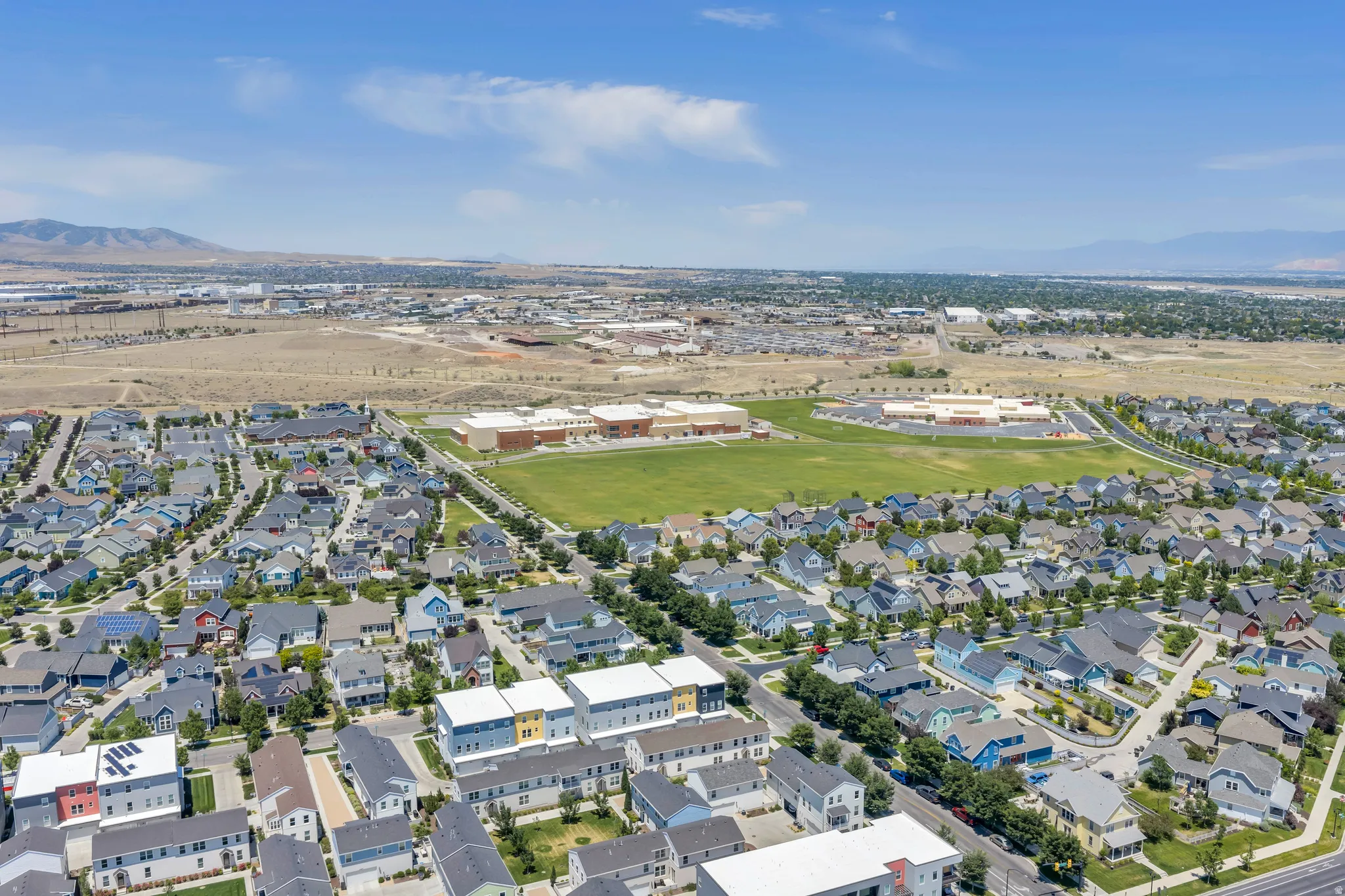 Expansive residential development featuring a variety of single-family homes and multi-story residences
