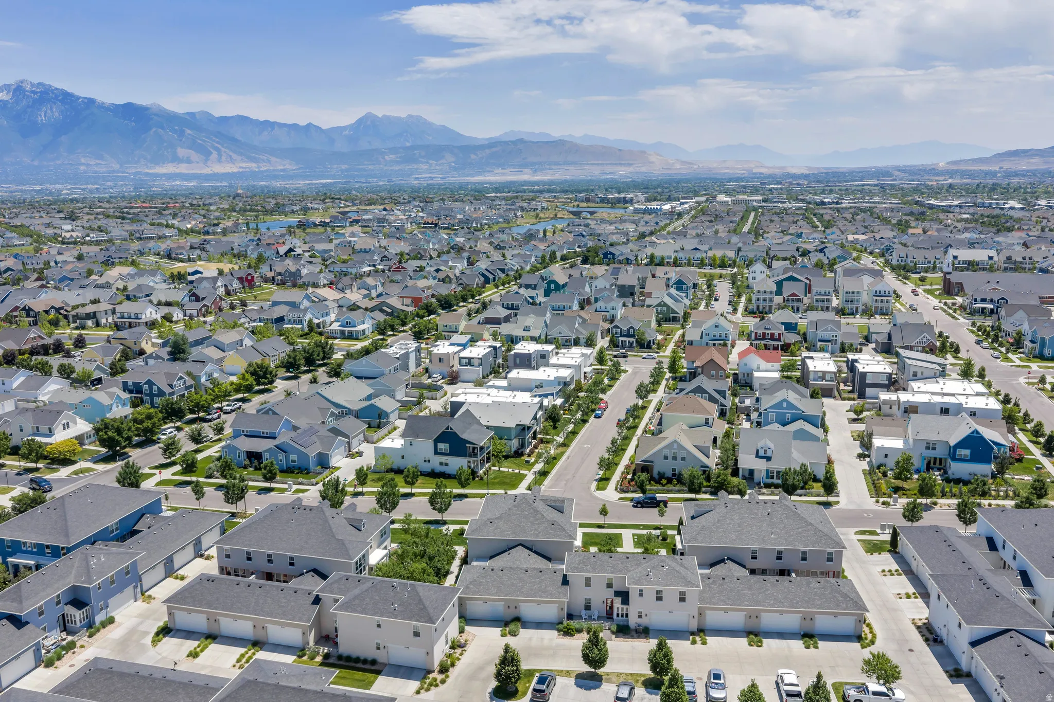 Expansive residential community featuring a variety of architectural styles, mature trees, and paved streets