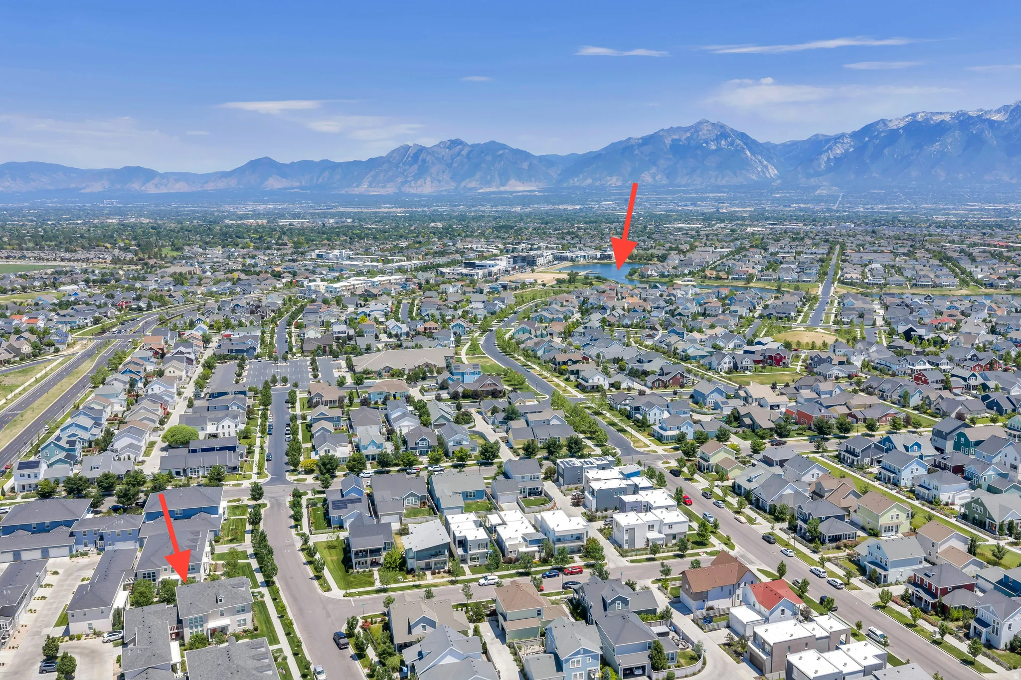 Aerial perspective showcasing a residential community with distant mountain ranges