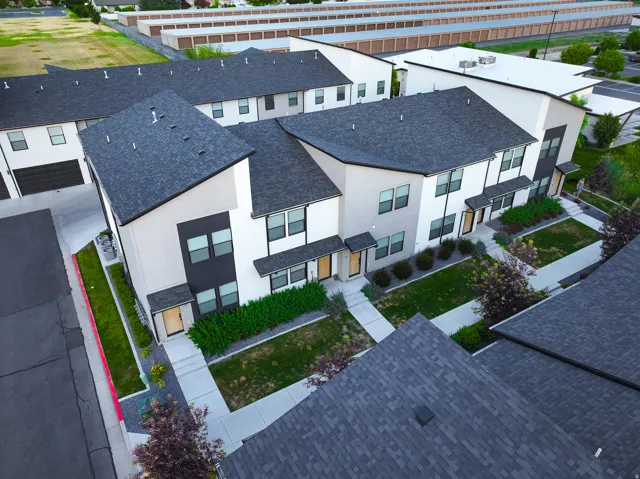 Contemporary townhomes featuring multi-tone facades and individual entrances