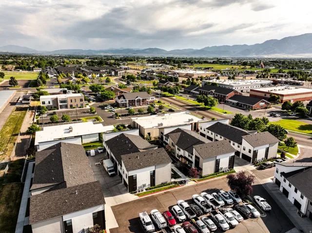 Contemporary multi-story townhomes featuring modern facades and individual garages