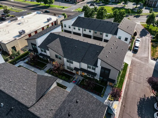 Modern townhome community featuring contemporary architectural design with white and dark gray facades