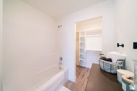 Bathtub and shower combination with chrome fixtures