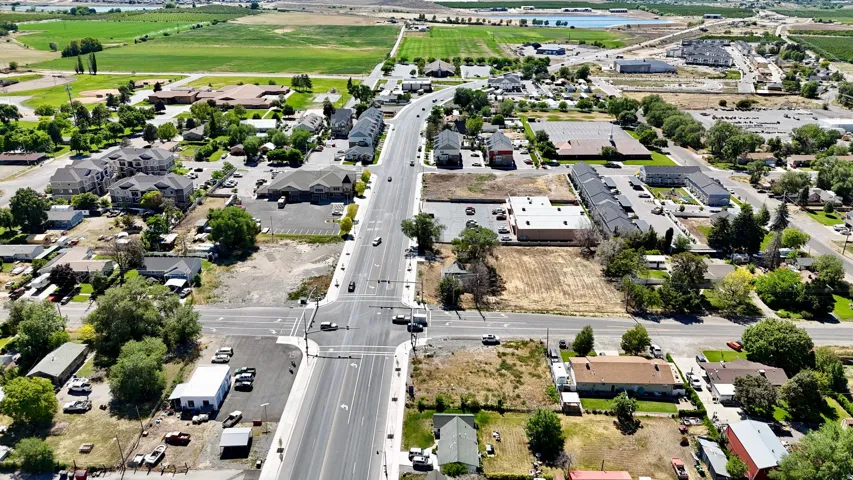 Aerial perspective showcasing a mixed-use area with residential structures and commercial buildings