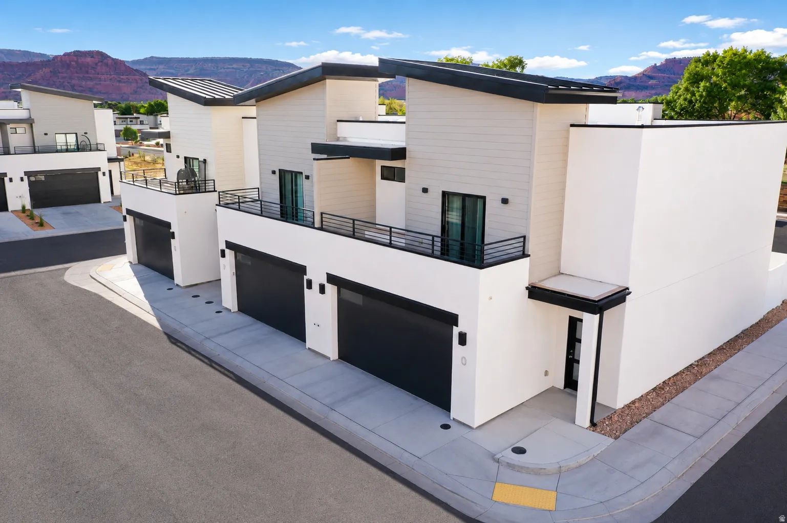 Contemporary exterior featuring white stucco and light-toned siding