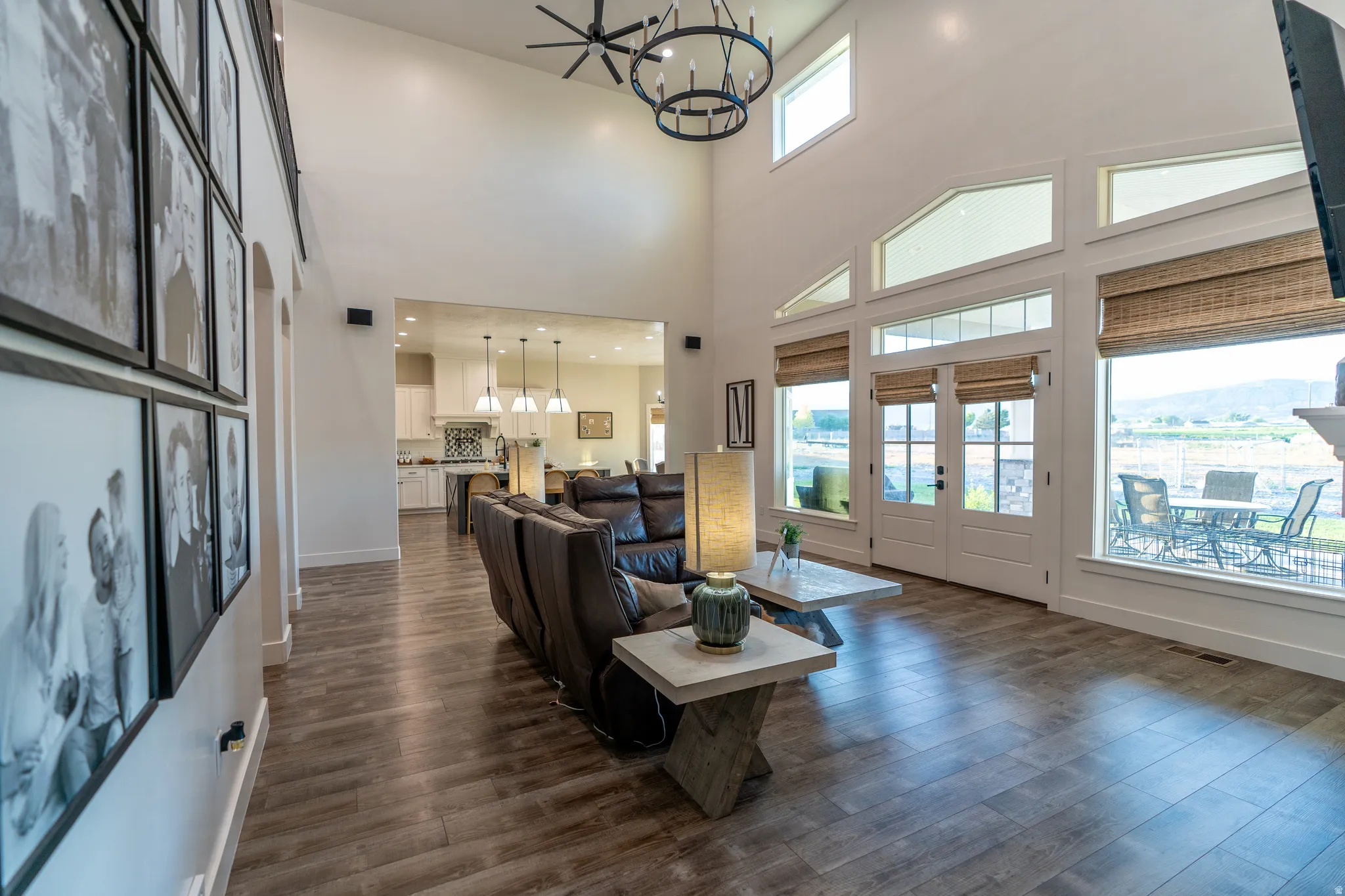 Vaulted living space featuring wood-finish flooring and an open concept layout