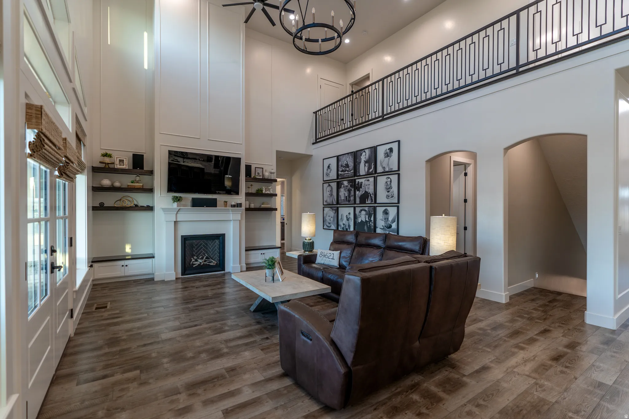 Two-story living area with wood-finish flooring
