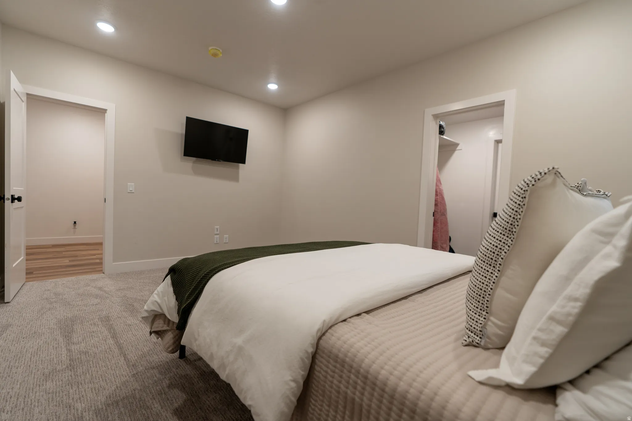 Carpeted bedroom featuring recessed lighting and neutral wall tones