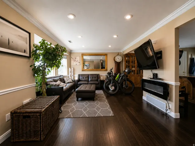 Dark wood-finish flooring complements the neutral wall tones
