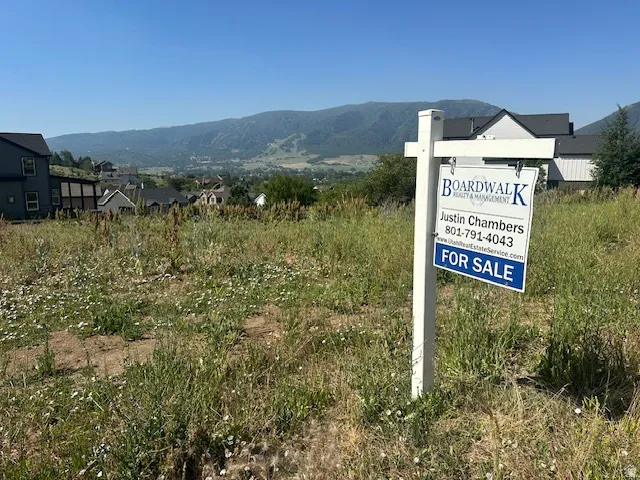Undeveloped parcel featuring varied vegetation and expansive mountain backdrops
