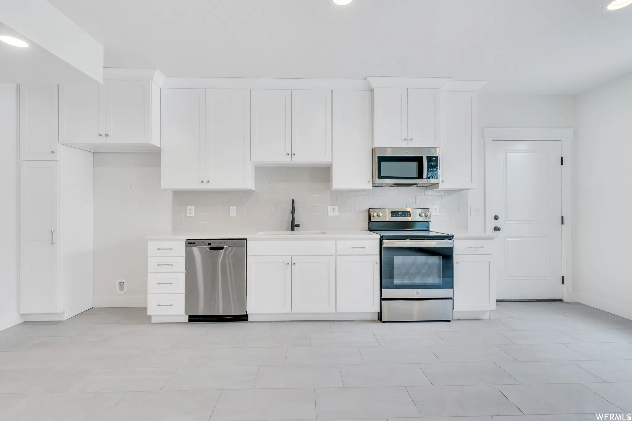 Basement has a full kitchen
