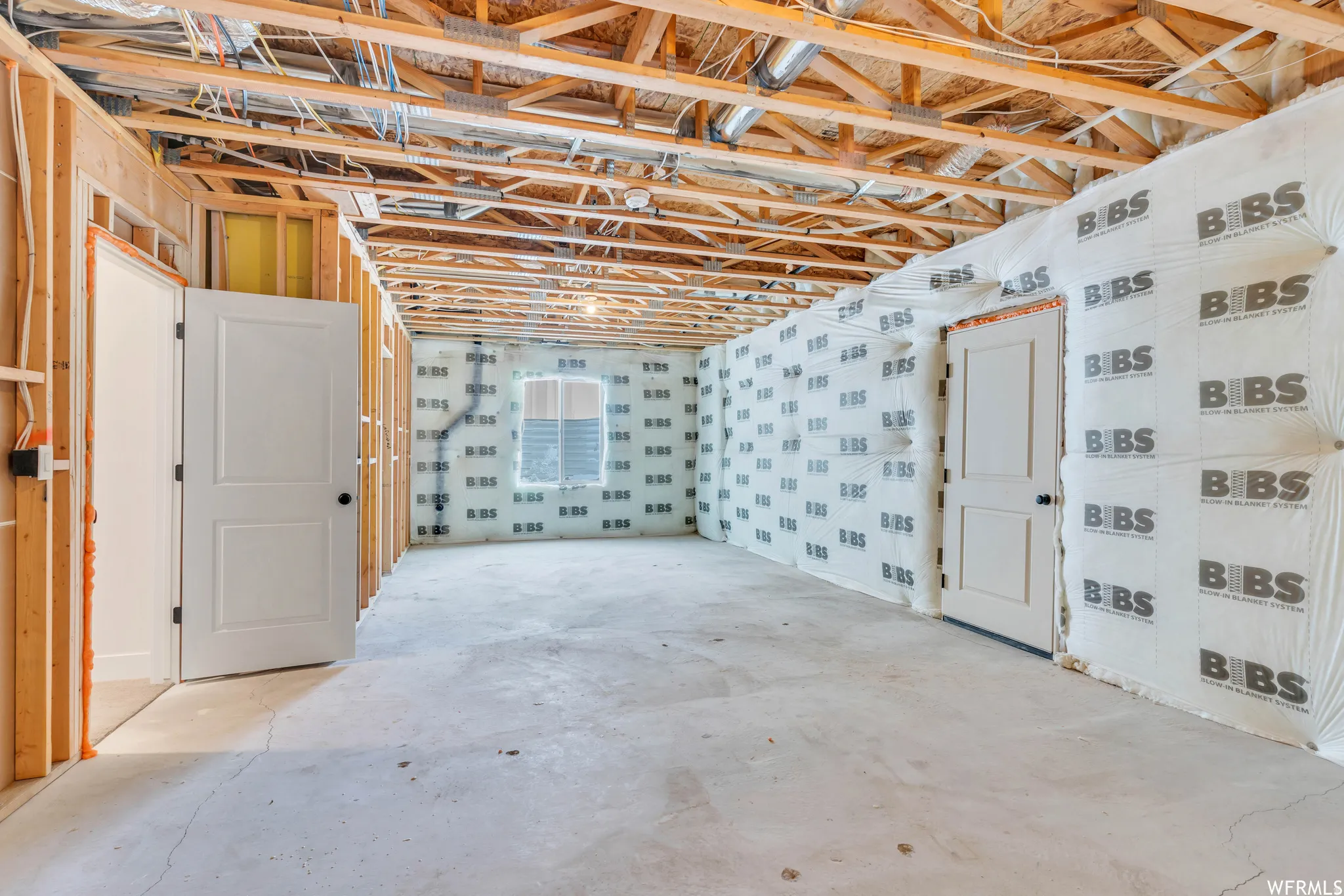 Unfinished bedroom area in the basement