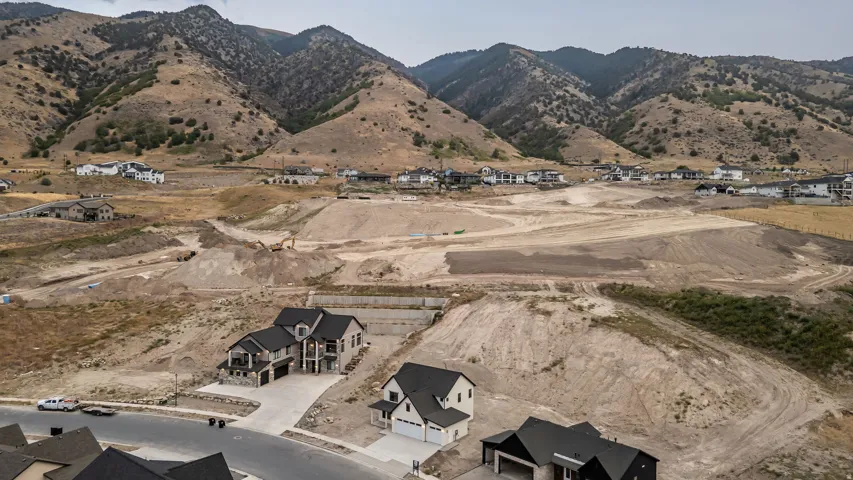 Newly constructed residences with mountain backdrop