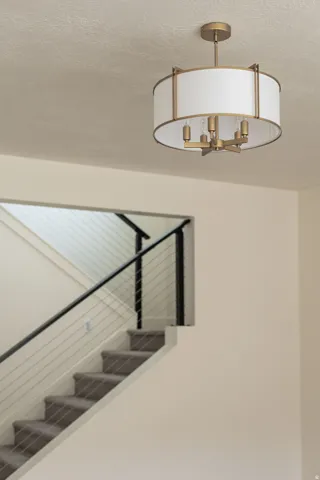 Drum-style semi-flush mount fixture with a gold-tone finish