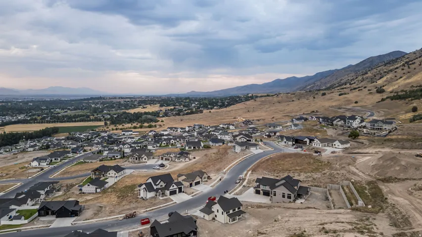 Expansive development featuring new construction homes with varied exterior finishes and multiple winding streets