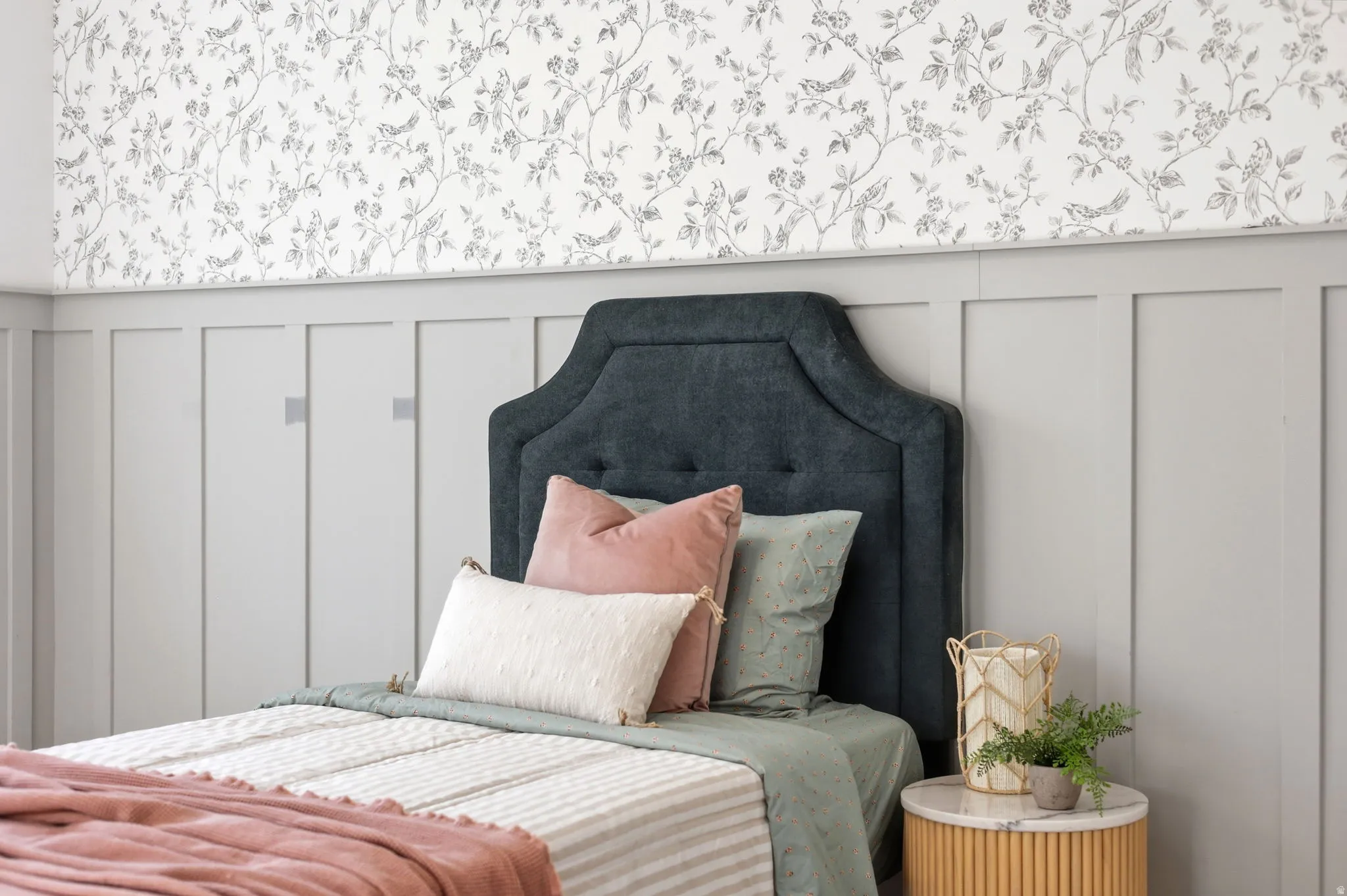 Wall paneling with a contrasting nature-inspired wallpaper